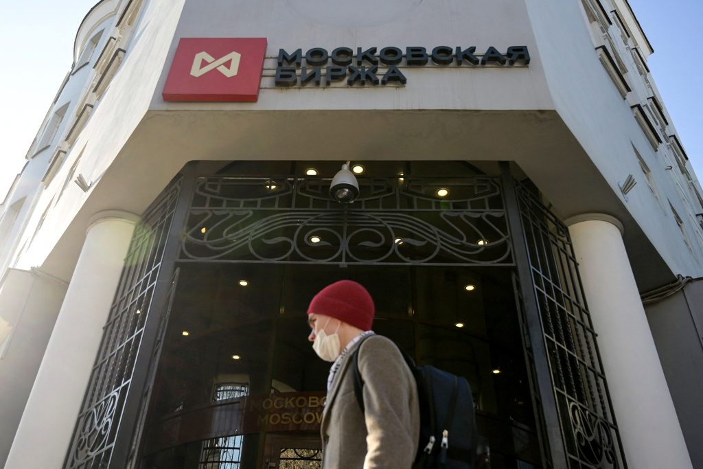 A man walks past the Moscow's stock market building in downtown Moscow on February 28.