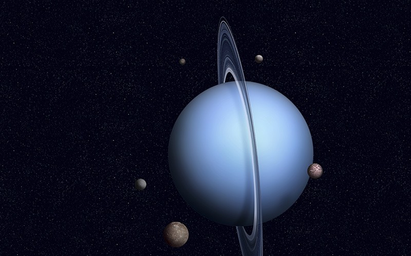 Urano como se muestra en una ilustración con algunas de sus 27 lunas.