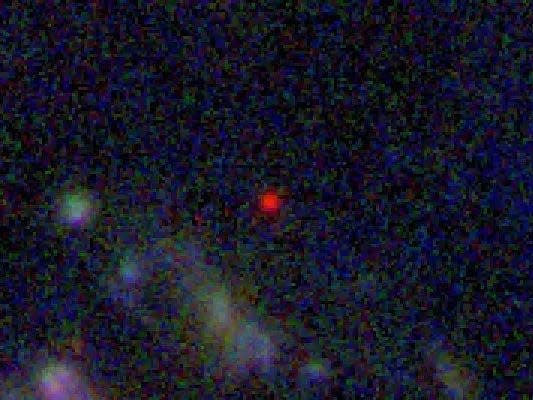 El punto rojo es la galaxia más antigua jamás observada.